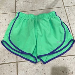 Bright green Nike athletic shorts
